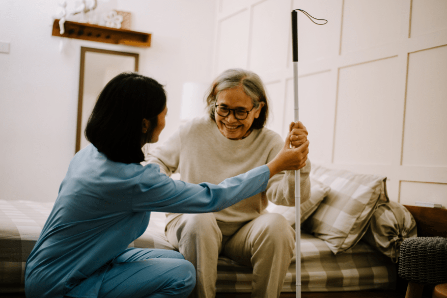 CNA Helping old women with mobility
